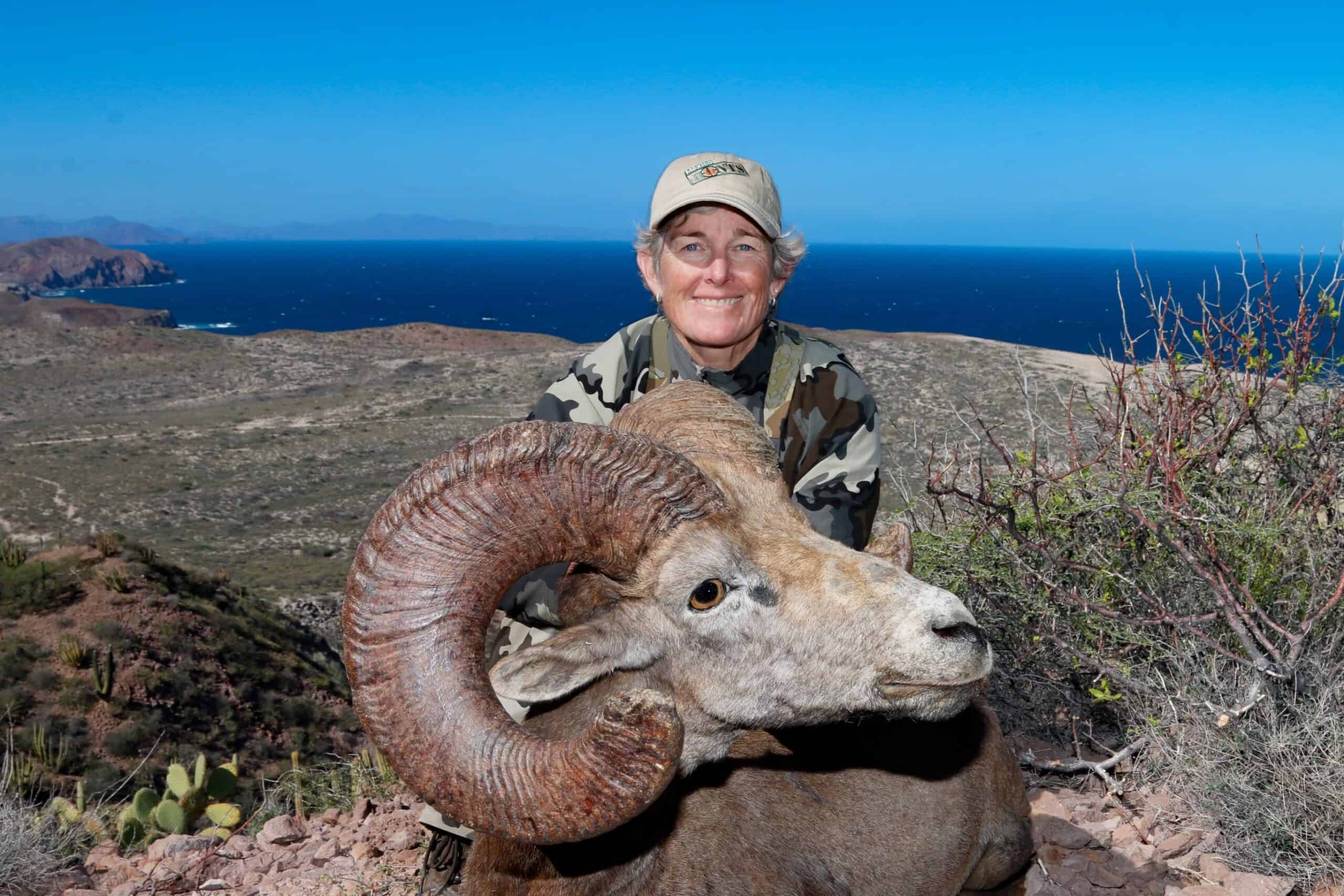 woman smiling with dead animal